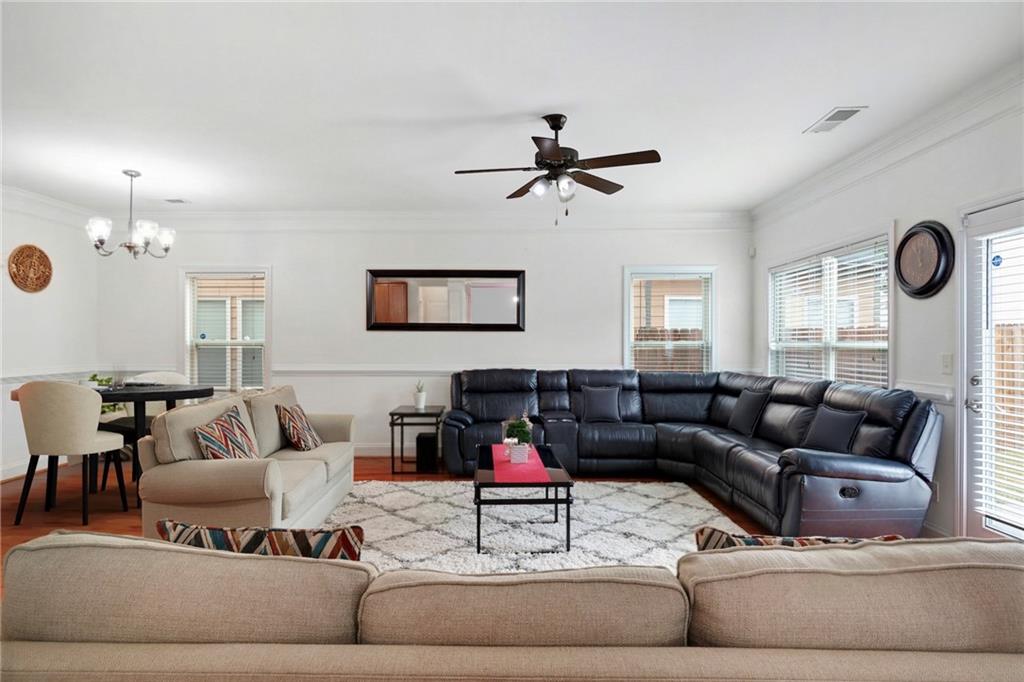 2325 Arnold Mill Road Northwest Lawrenceville, GA 30044 - Photo 9 of 40 a living room with furniture or couch and a ceiling fan