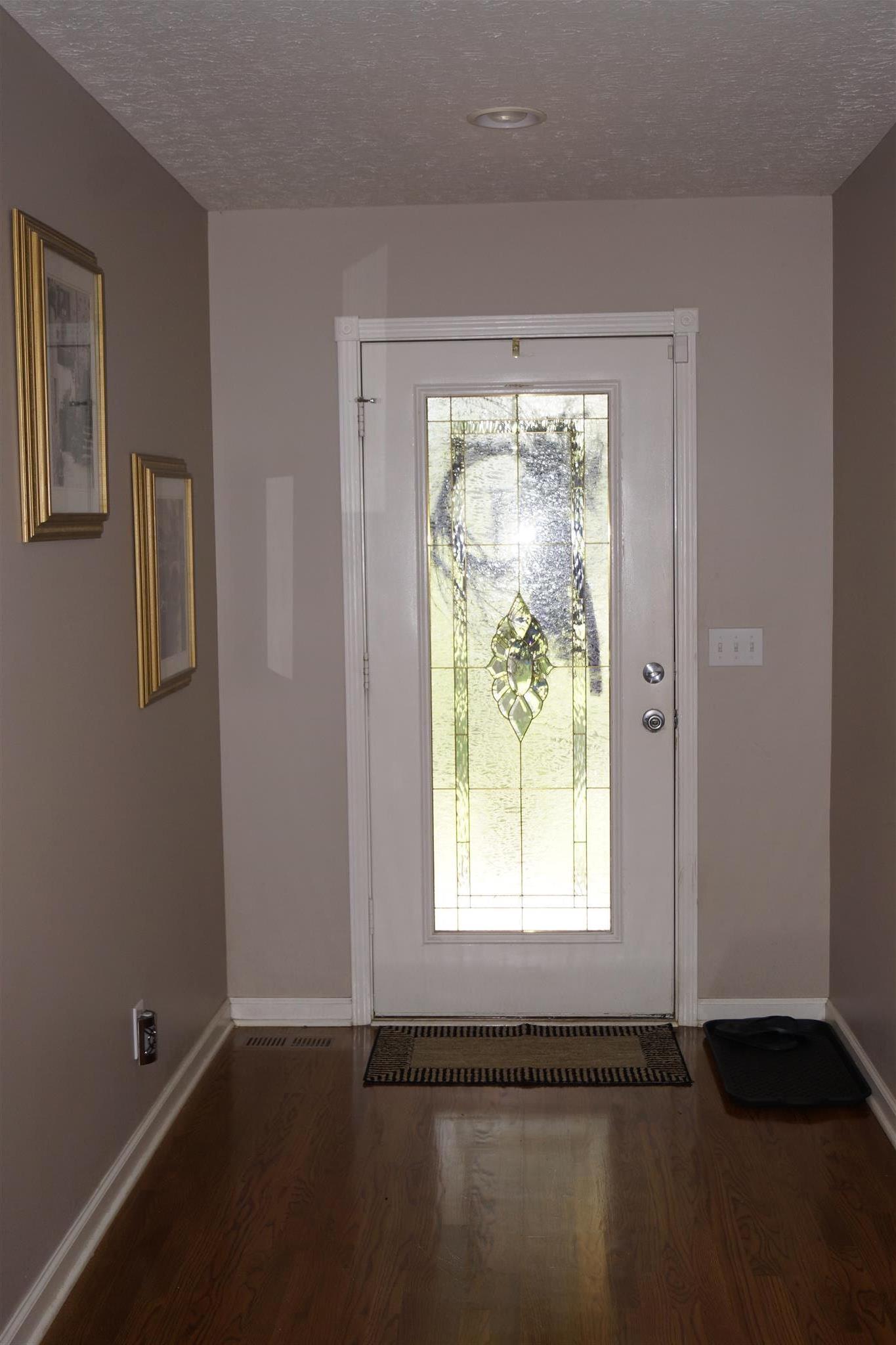 6622 Gum Station Road Springfield, TN 37172 - Photo 14 of 30 an empty room with wooden floor and windows