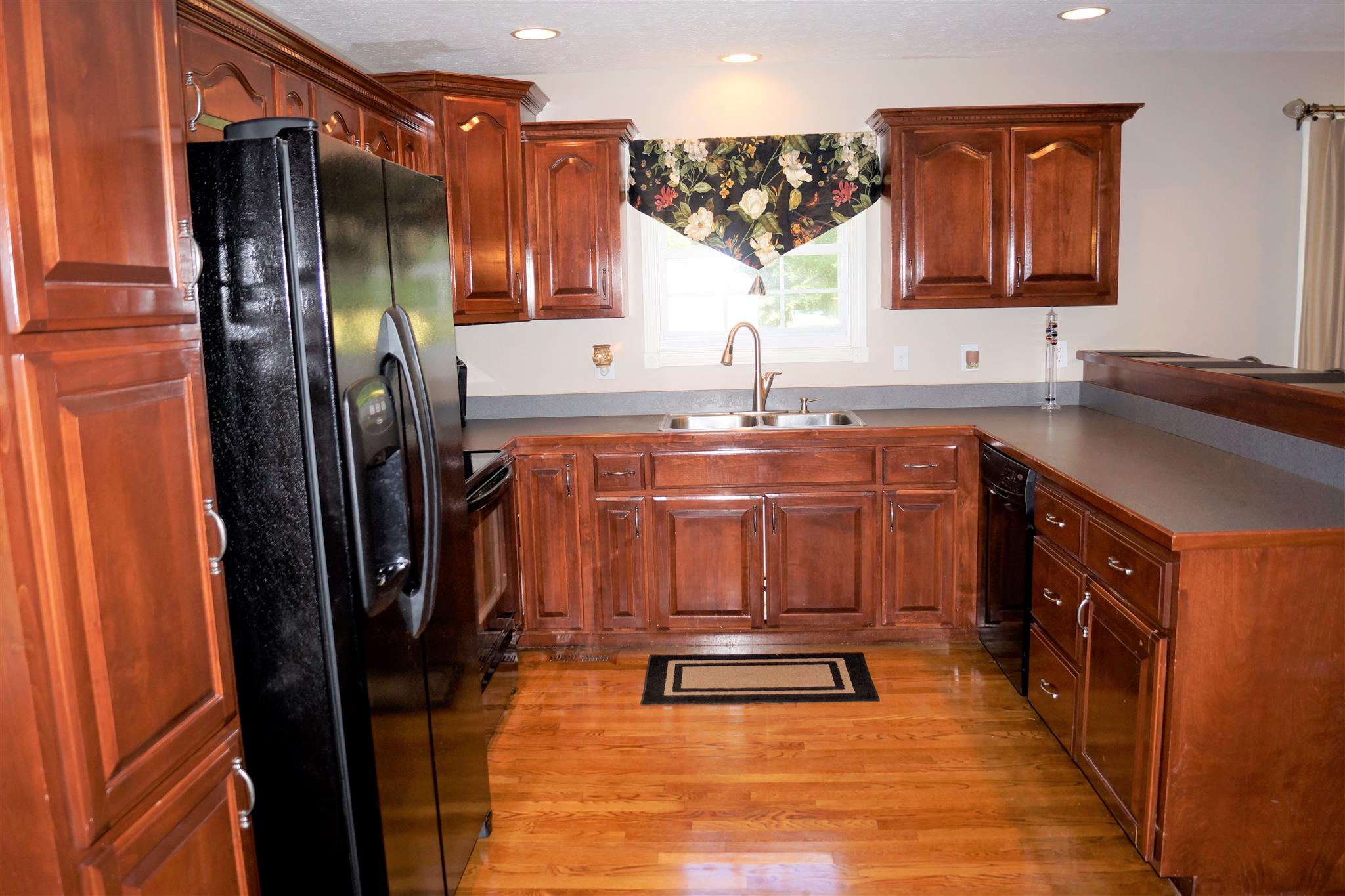6622 Gum Station Road Springfield, TN 37172 - Photo 8 of 30 a kitchen with stainless steel appliances granite countertop a refrigerator and a sink