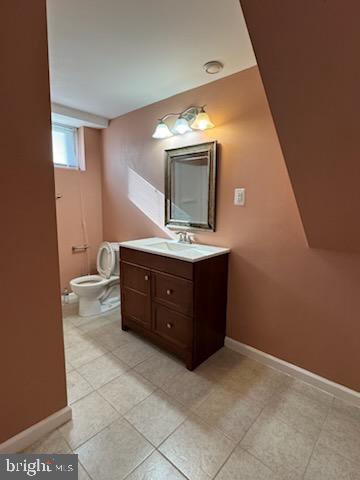 9207 4th Street Lanham, MD 20706 - Photo 12 of 14 a bathroom with a vanity a sink a mirror and bathtub