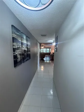 a view of entryway and kitchen