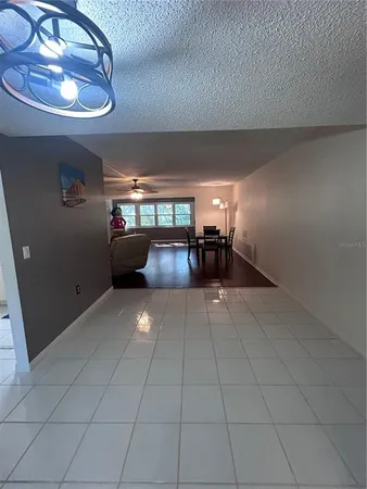 a view of kitchen with furniture and a window