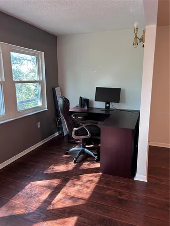 a workspace with furniture and window