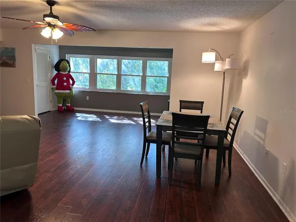a workspace with furniture window and wooden floor