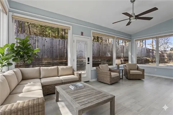 a living room with furniture and a large window