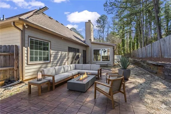 a outdoor space with patio furniture and a fireplace
