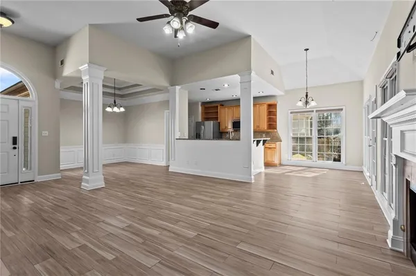 wooden floor in an empty room with a fireplace