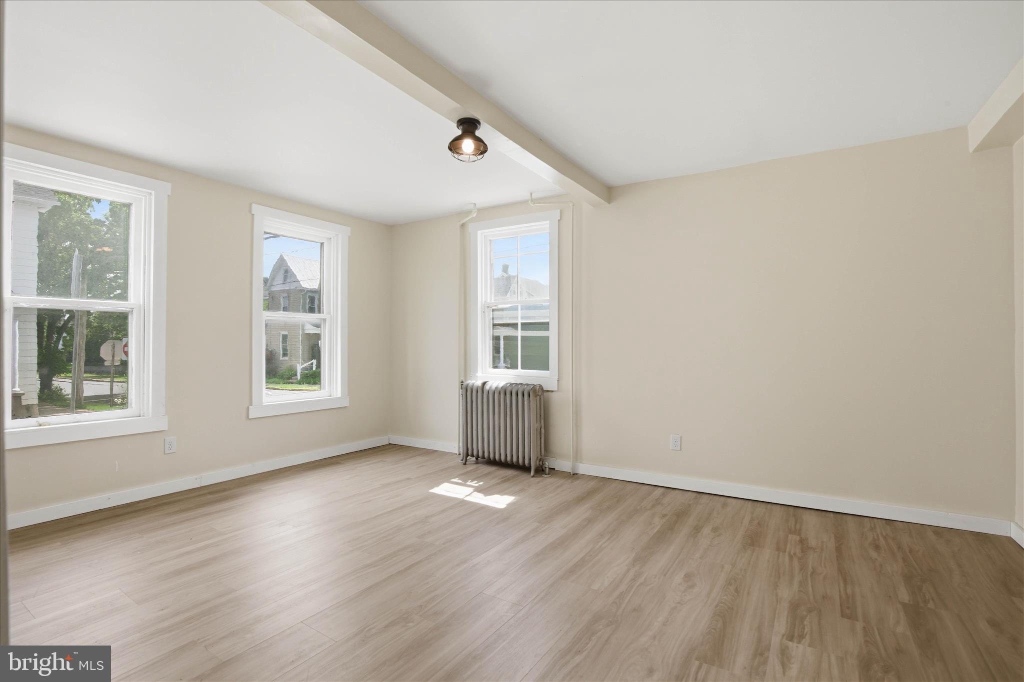 101 East Lincoln Avenue Lititz, PA 17543 - Photo 18 of 39 an empty room with wooden floor and windows