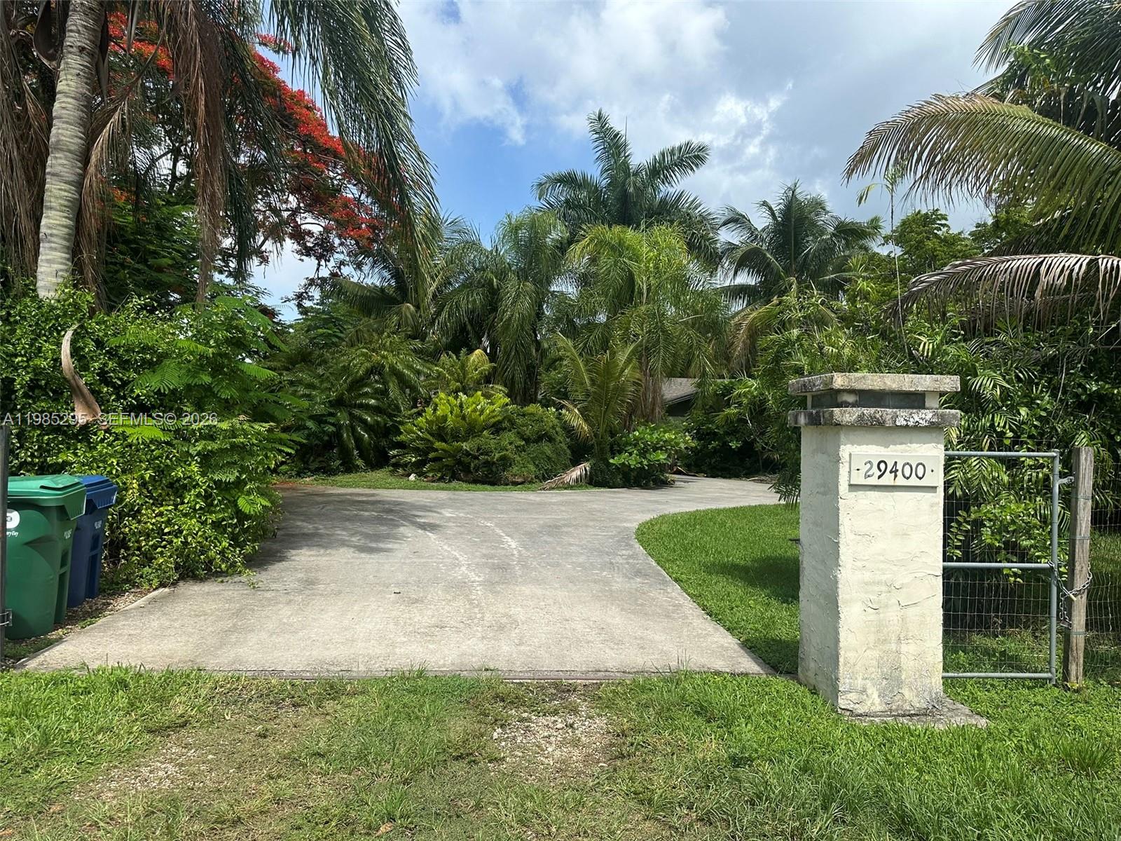 29400 Southwest 179th Avenue Homestead, FL 33030 - Photo 1 of 49 a sign board with yard