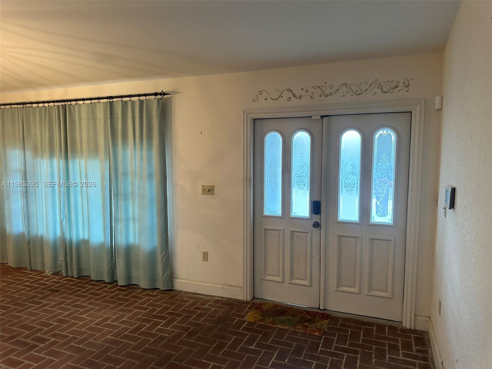 29400 Southwest 179th Avenue Homestead, FL 33030 - Photo 23 of 49 an empty room with windows