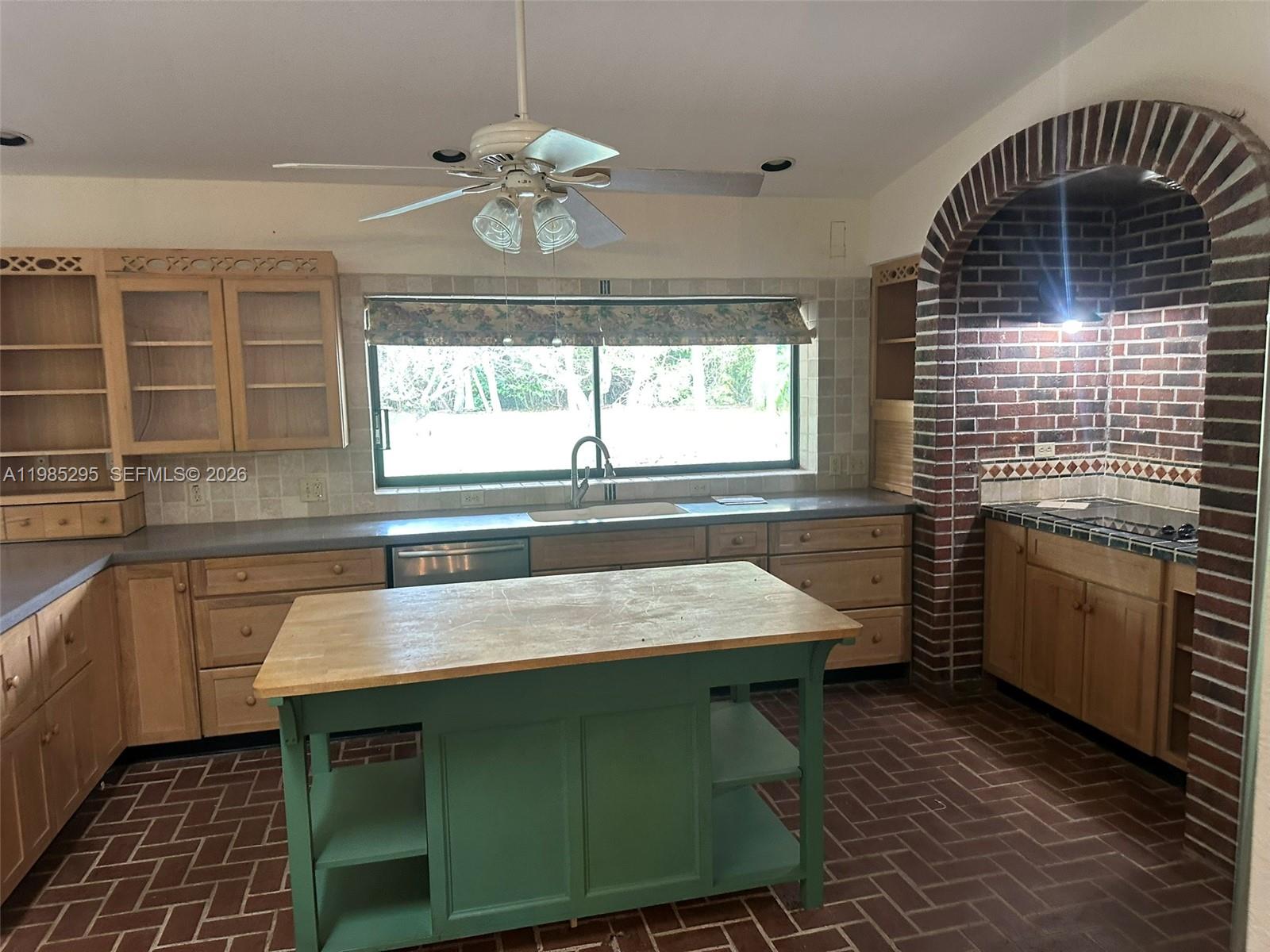 29400 Southwest 179th Avenue Homestead, FL 33030 - Photo 26 of 49 a kitchen with a sink stove and cabinets