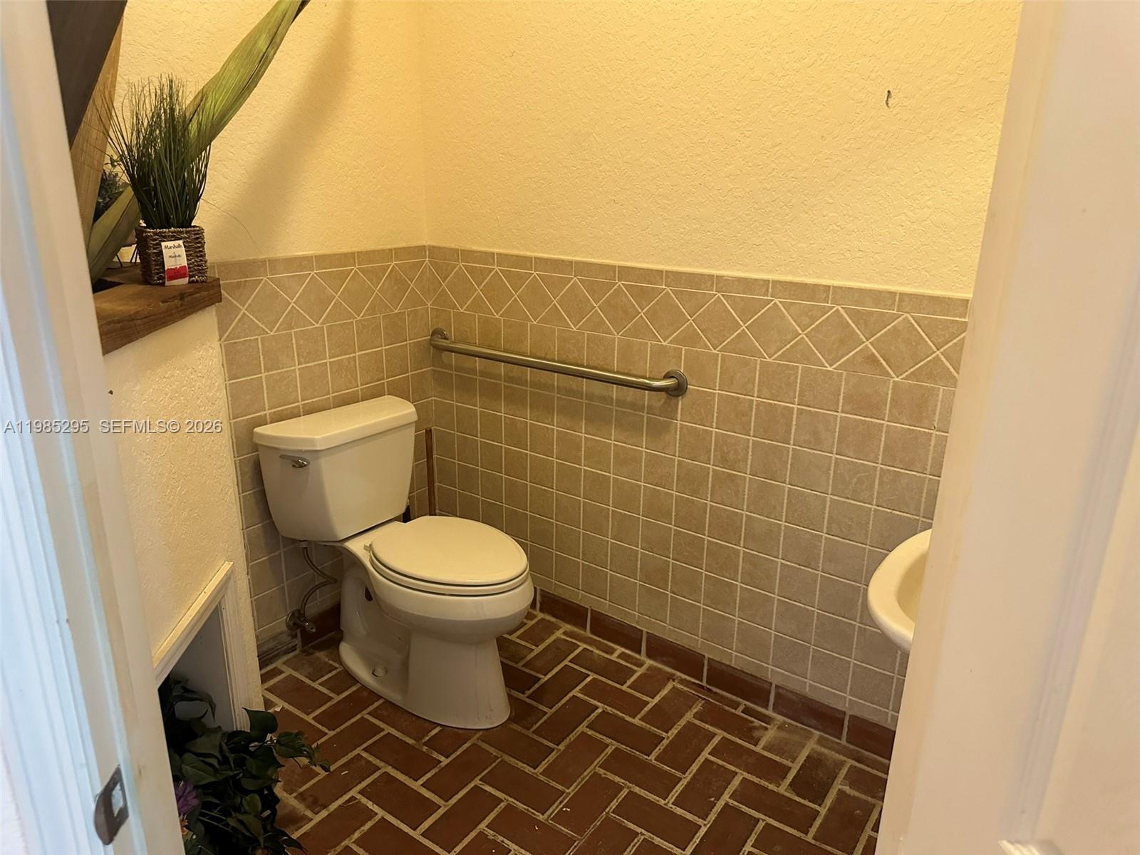 29400 Southwest 179th Avenue Homestead, FL 33030 - Photo 27 of 49 a bathroom with a toilet and a sink