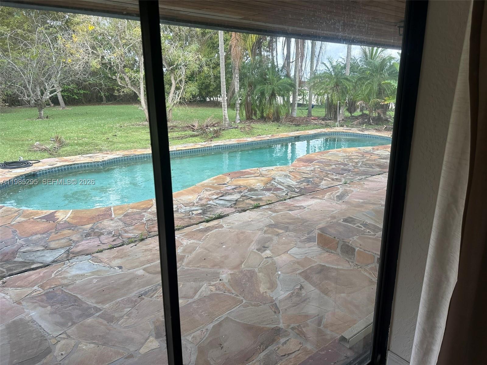 29400 Southwest 179th Avenue Homestead, FL 33030 - Photo 31 of 49 a view of a yard from a window