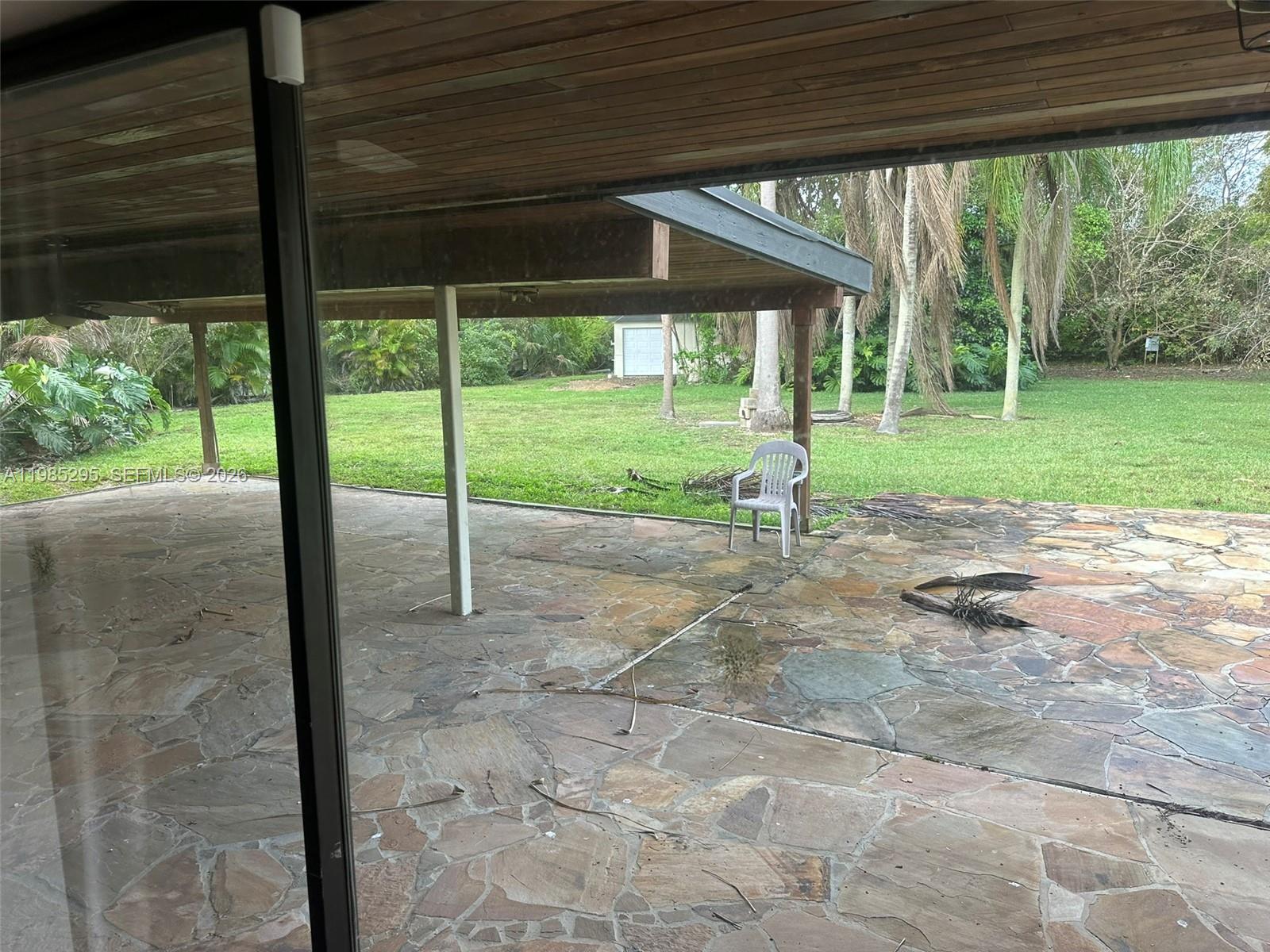 29400 Southwest 179th Avenue Homestead, FL 33030 - Photo 32 of 49 a view of a porch with a backyard