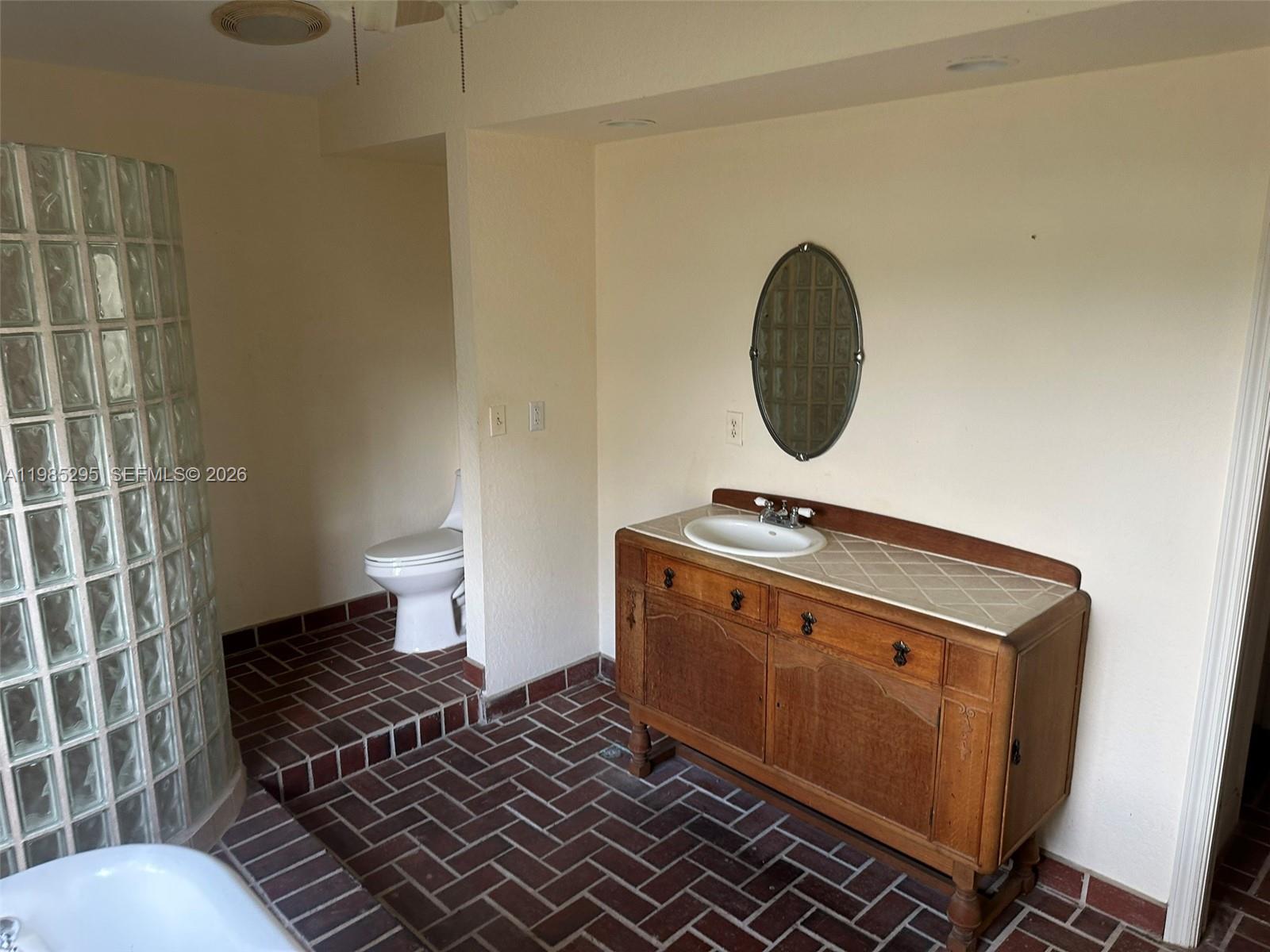 29400 Southwest 179th Avenue Homestead, FL 33030 - Photo 47 of 49 a bathroom with a sink and a mirror