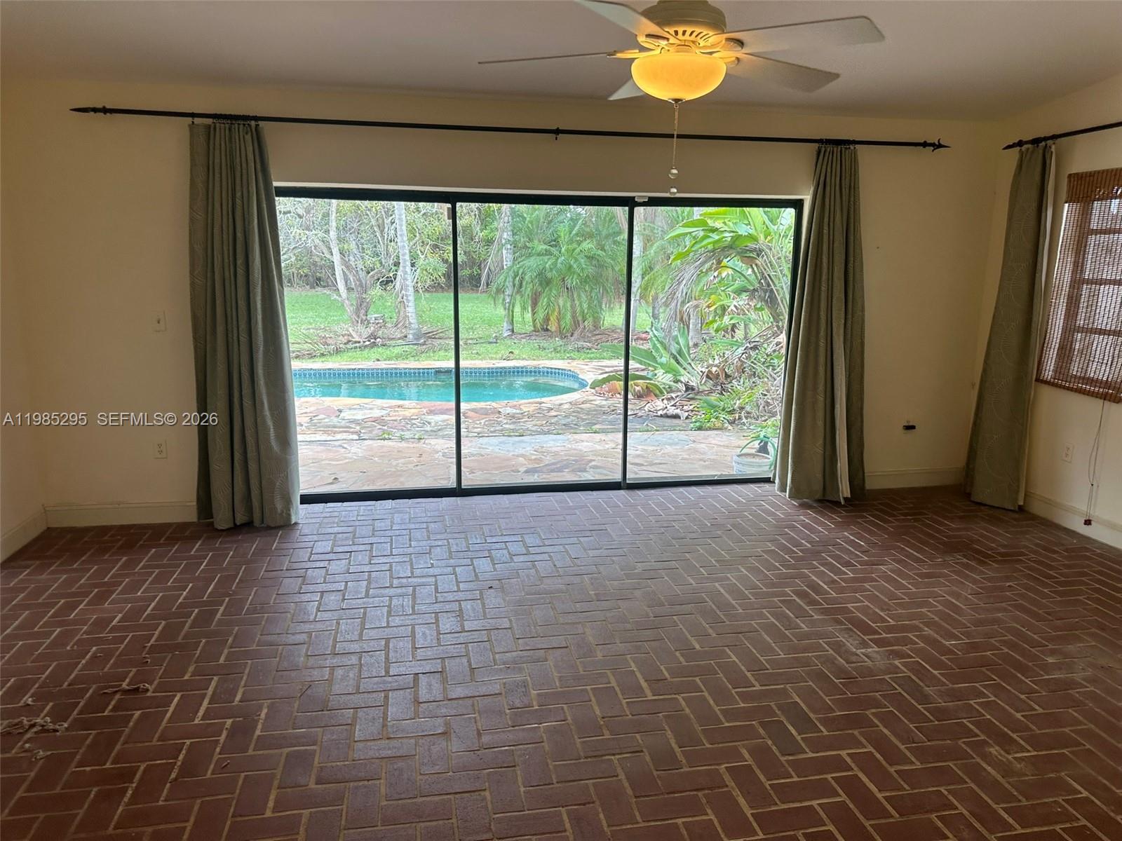 29400 Southwest 179th Avenue Homestead, FL 33030 - Photo 49 of 49 a view of room with window and floor to ceiling window