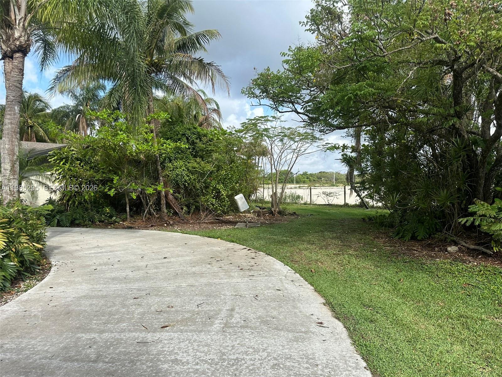 29400 Southwest 179th Avenue Homestead, FL 33030 - Photo 7 of 49 a view of a park with plants and trees