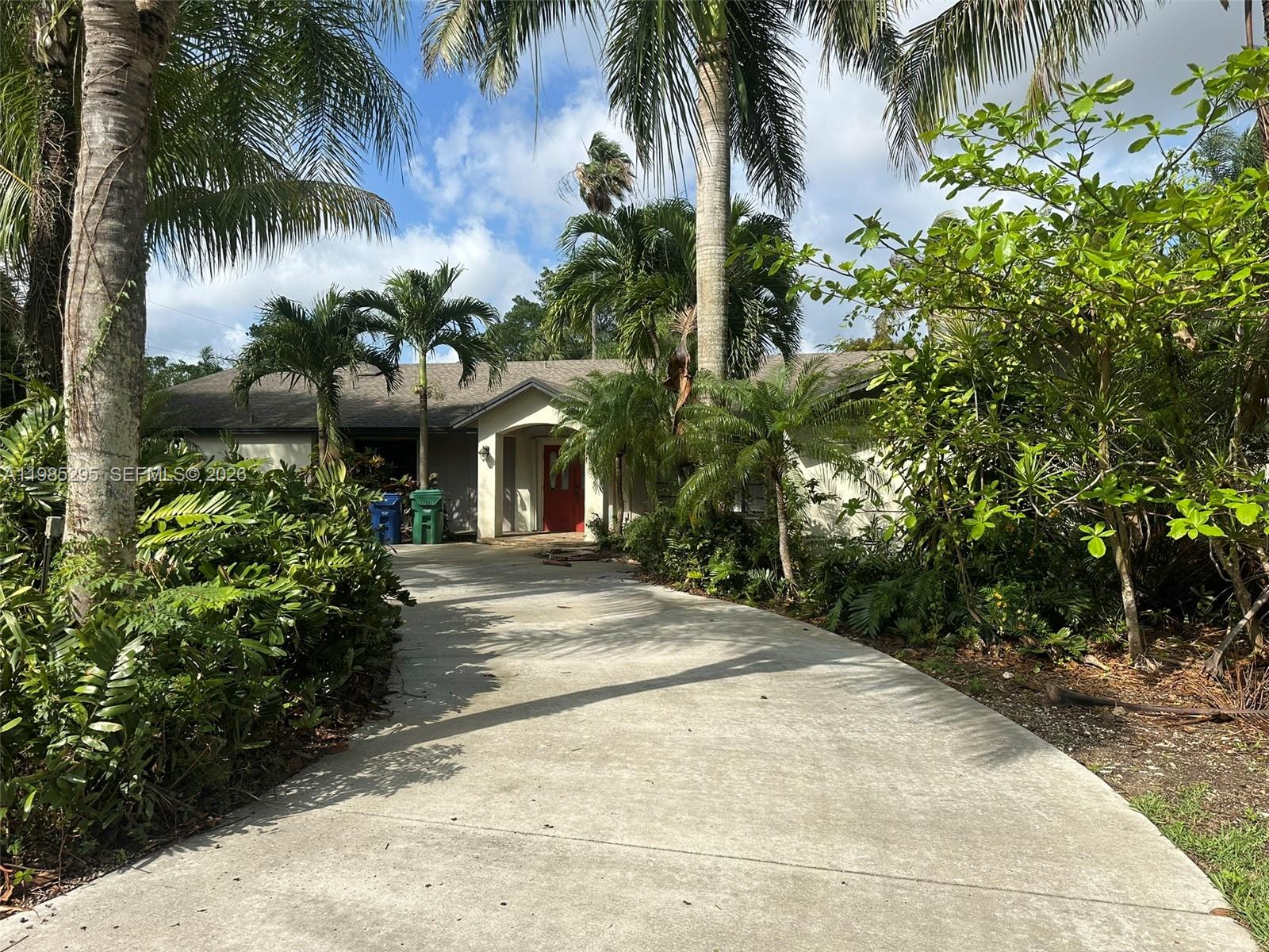 29400 Southwest 179th Avenue Homestead, FL 33030 - Photo 8 of 49 a view of a backyard with palm trees
