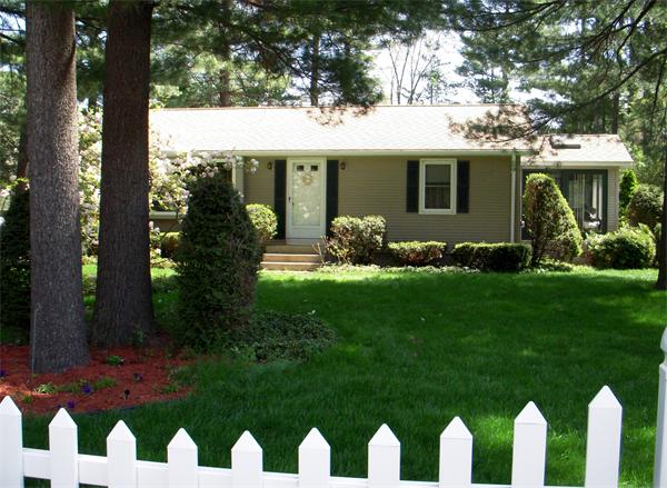 40 County Road Holyoke, MA 01040 - Photo 5 of 19 a front view of a house with a garden and yard