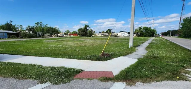 a view of a garden with houses