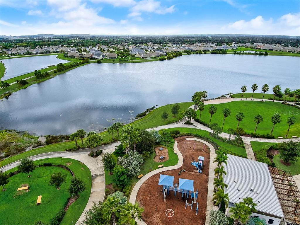 6262 Goldcoast Avenue Apollo Beach, FL 33572 - Photo 47 of 65 an aerial view of a house with a lake view and mountain view