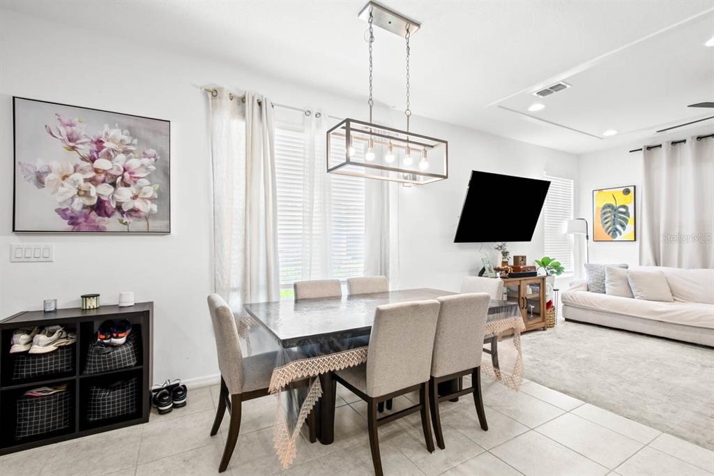 6262 Goldcoast Avenue Apollo Beach, FL 33572 - Photo 5 of 65 a view of a livingroom with furniture and a flat screen tv