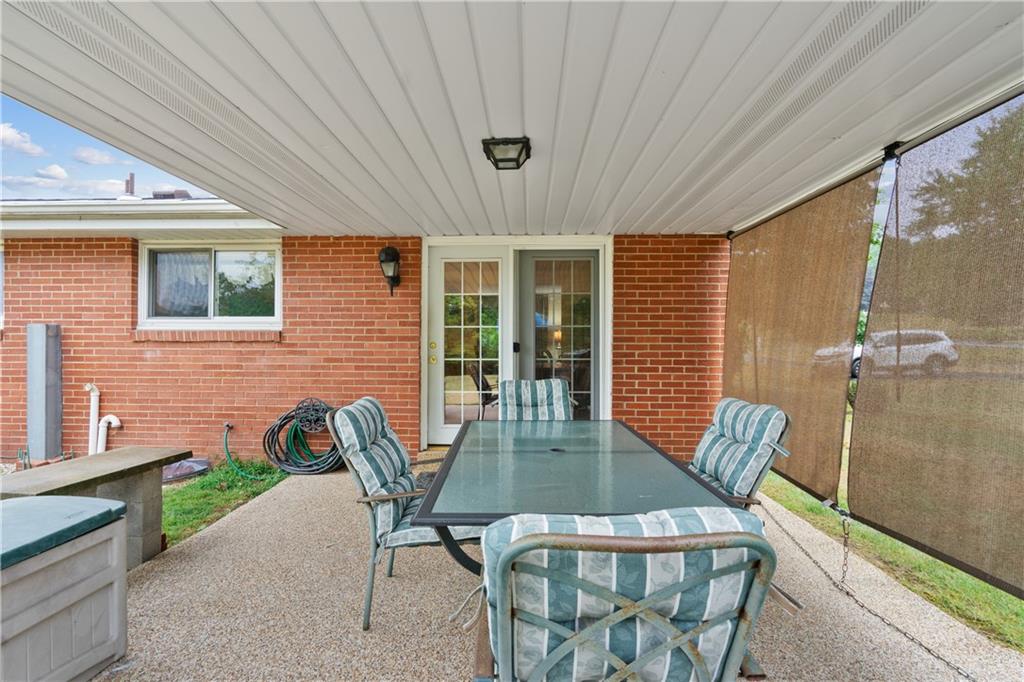 5251 Stella Drive Gibsonia, PA 15044 - Photo 6 of 23 Covered deck with door leading to kitchen