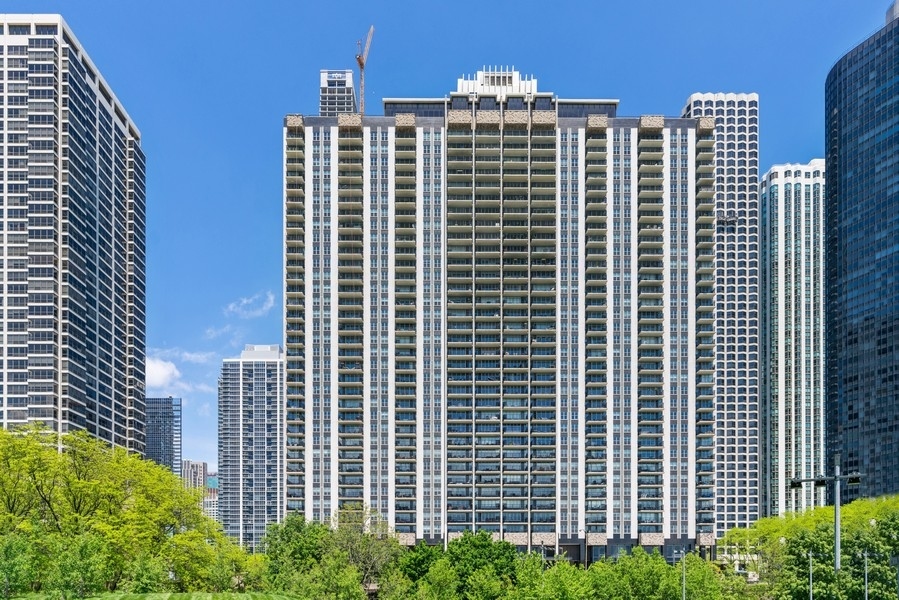 400 East Randolph Street, Unit 3324 Chicago, IL 60601 - Photo 28 of 28 a front view of a building with a yard
