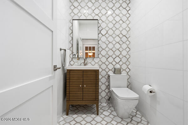 54 Georgetown Road Eatontown, NJ 07724 - Photo 3 of 24 a bathroom with a toilet and a sink