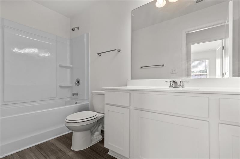 103 Rydal Way Winder, GA 30680 - Photo 23 of 31 a bathroom with a sink toilet and shower