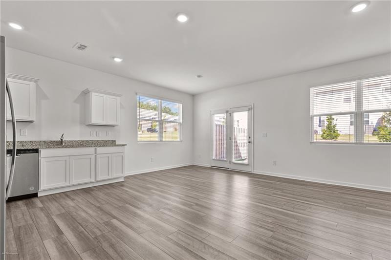 103 Rydal Way Winder, GA 30680 - Photo 4 of 31 a view of an empty room with window and wooden floor