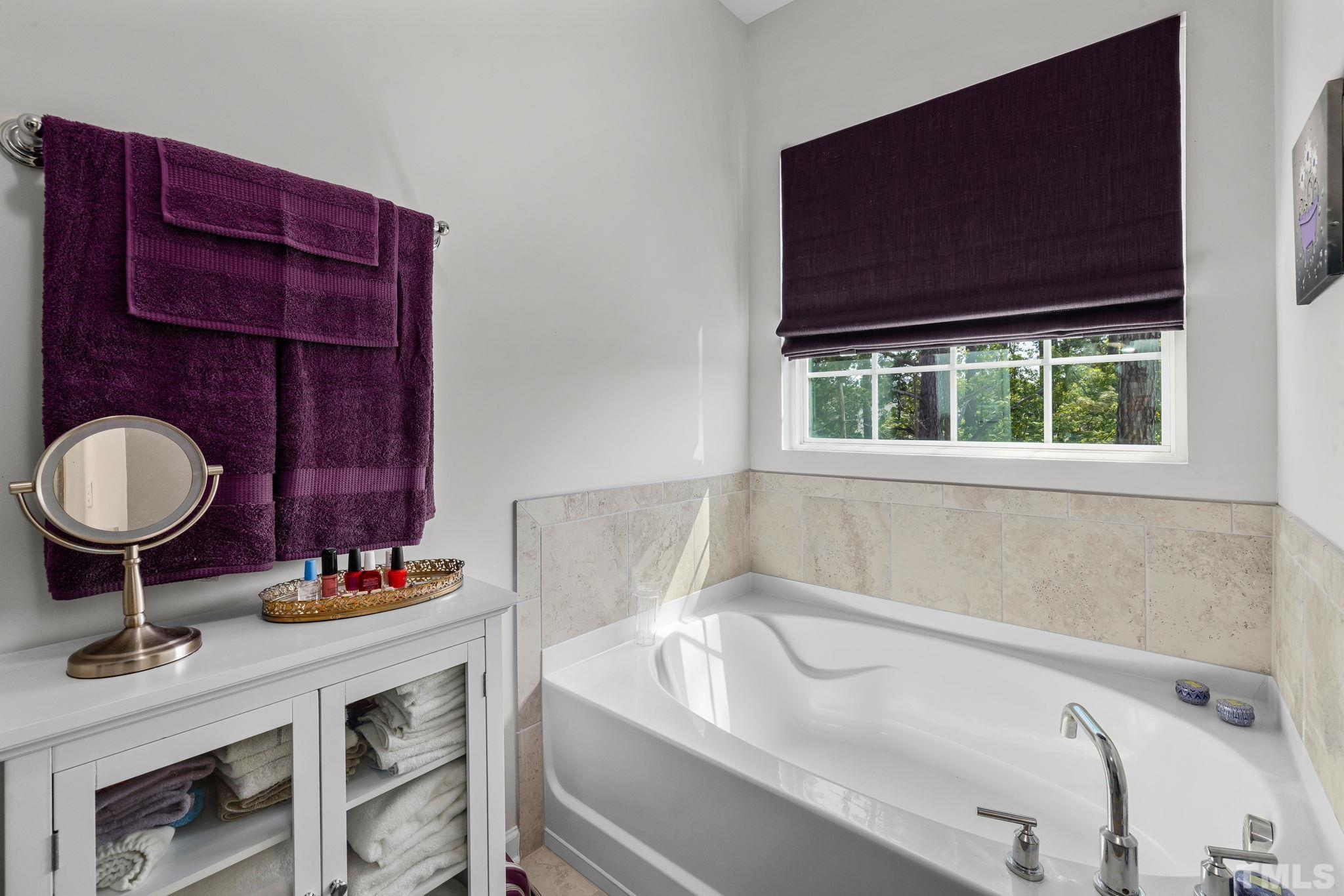 6084 Beale Loop Raleigh, NC 27616 - Photo 24 of 30 a bathroom with a sink and a bathtub