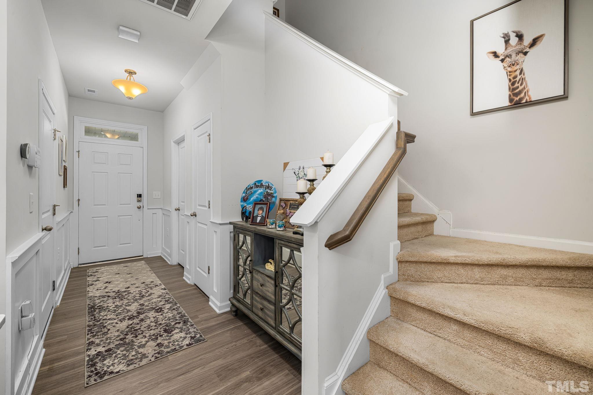 6084 Beale Loop Raleigh, NC 27616 - Photo 3 of 30 a view of entryway with furniture and front door
