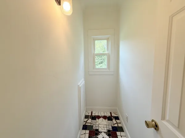 a bathroom with a sink and a window