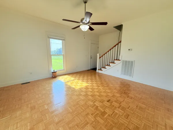 a view of an empty room with a window