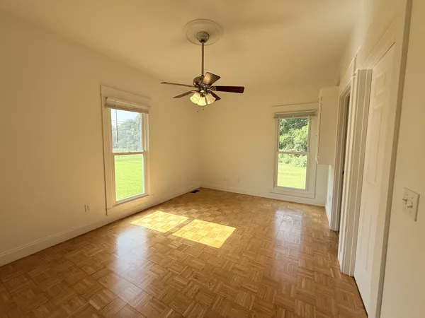 a view of empty room with windows