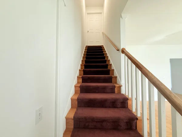 an empty room with a window and closet