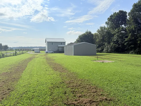 a view of a house with a big yard