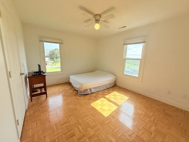 a bedroom with a bed and a table in it