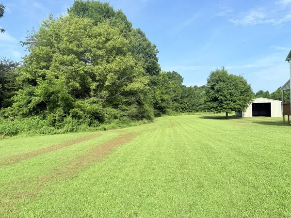 a view of a field with an outdoor space