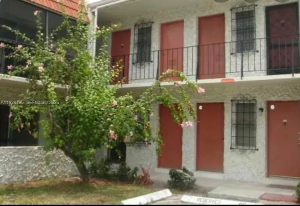 a balcony with an outdoor seating