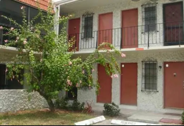 a balcony with an outdoor seating