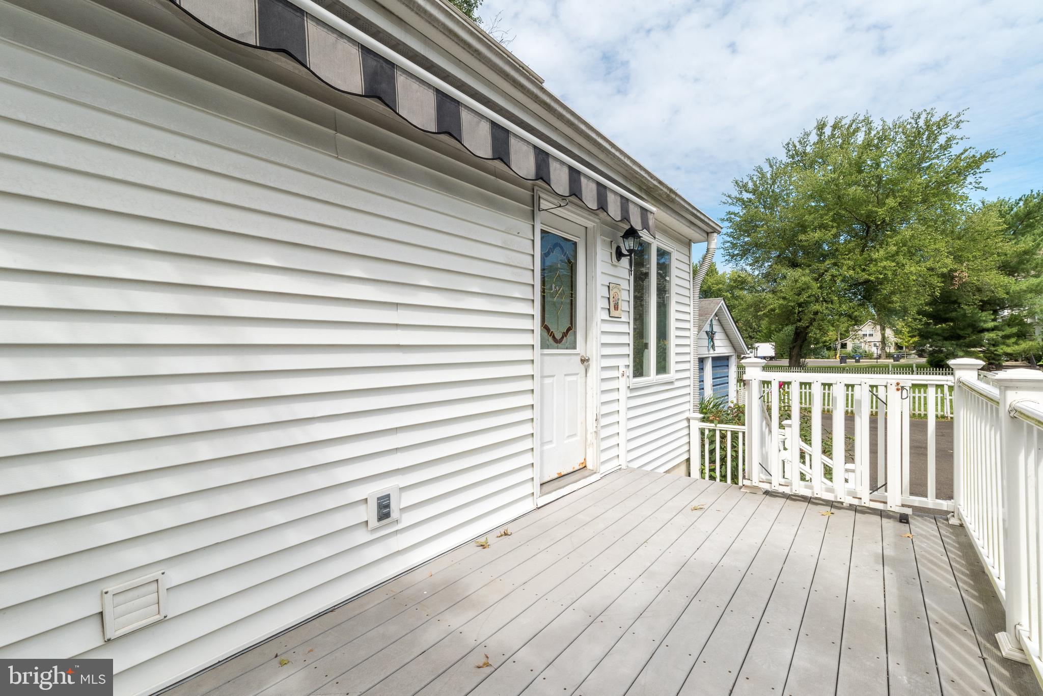 123 Iron Hill Road Doylestown, PA 18901 - Photo 25 of 34 Side deck with awning
