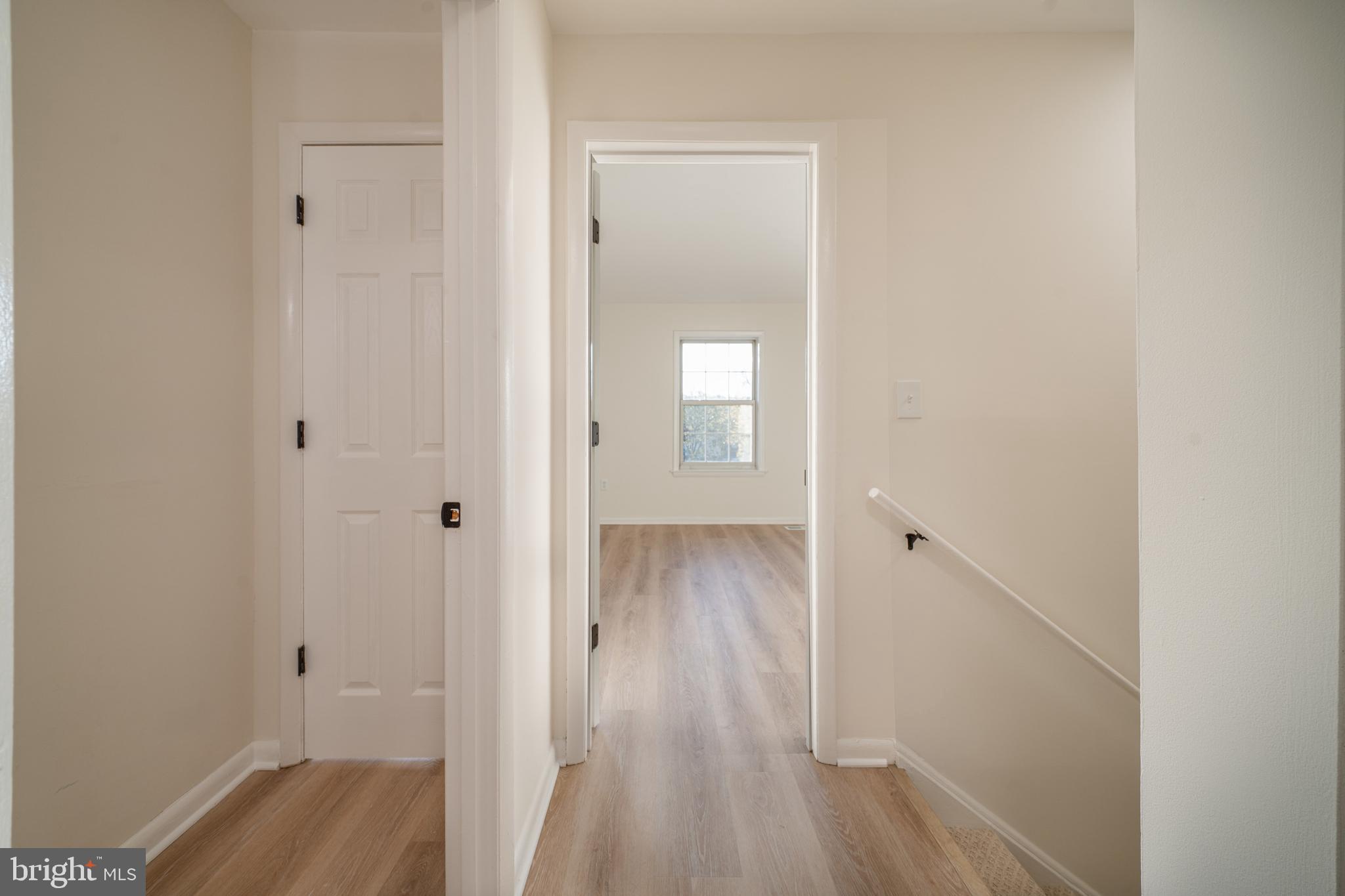 4631 Minnesota Avenue Northeast Washington, DC 20019 - Photo 17 of 28 a view of a hallway with wooden floor