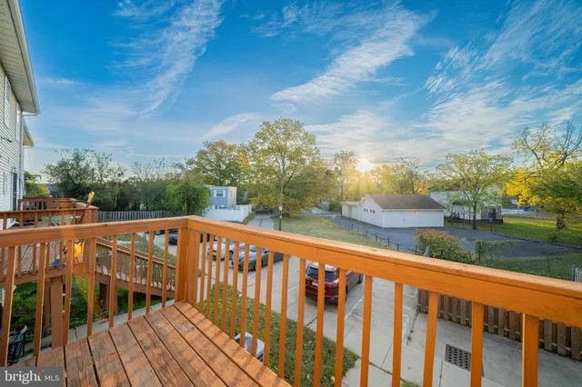 a view of a balcony with wooden floor