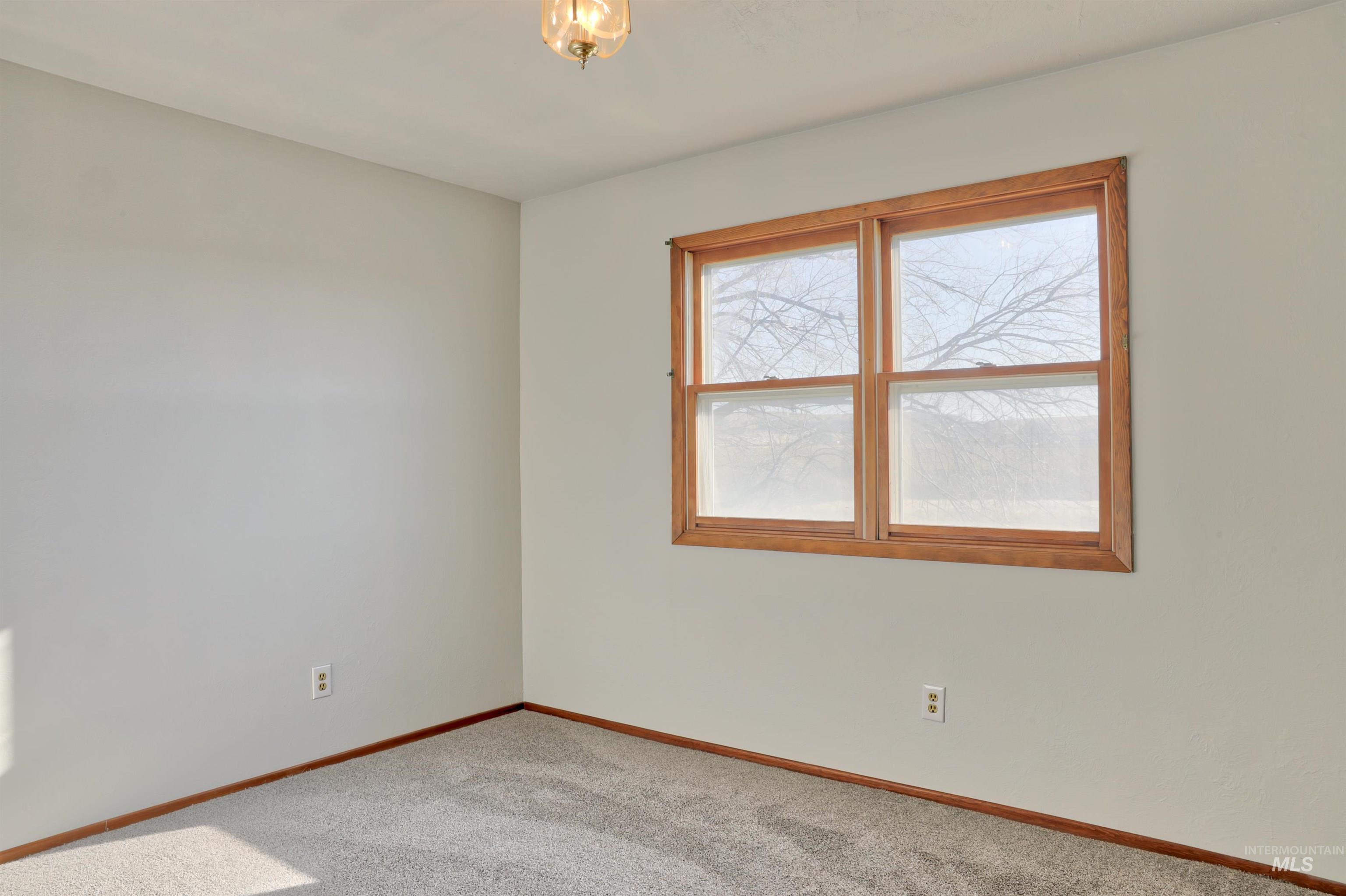 8027 Chuckar Lane Boise, ID 83709 - Photo 12 of 19 Spare room with carpet and baseboards