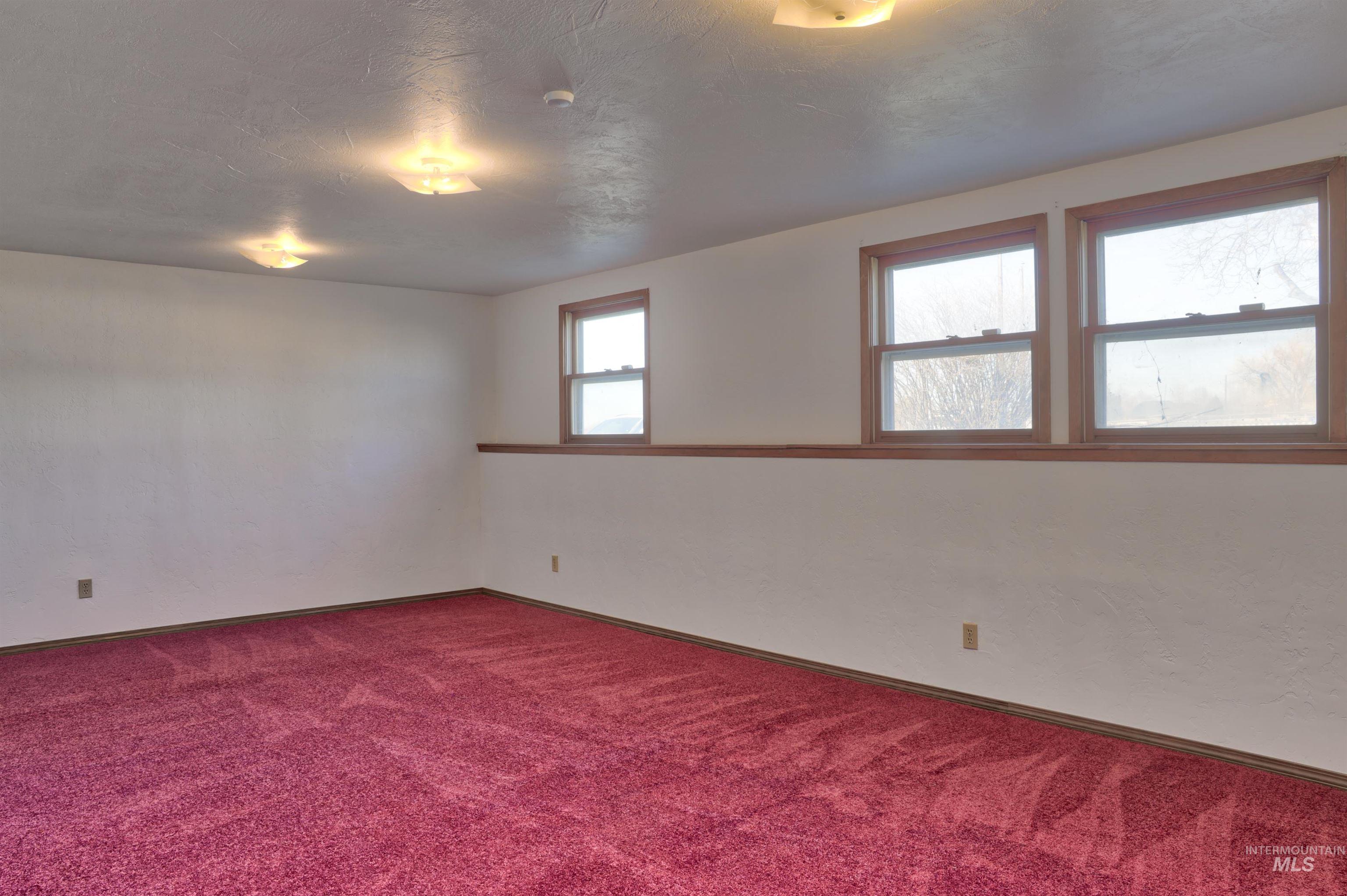 8027 Chuckar Lane Boise, ID 83709 - Photo 15 of 19 Carpeted spare room featuring baseboards