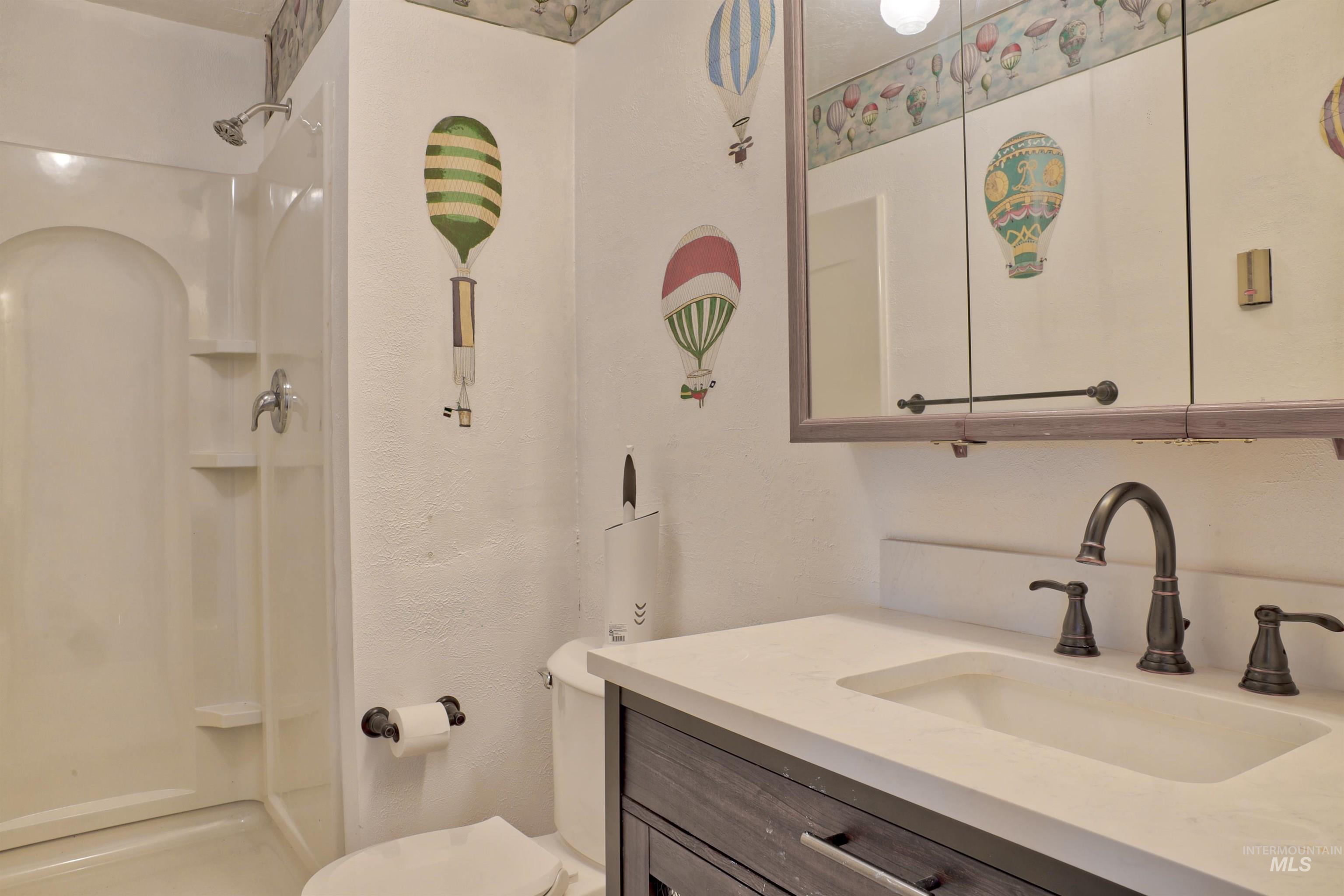 8027 Chuckar Lane Boise, ID 83709 - Photo 18 of 19 Bathroom with vanity and a shower stall