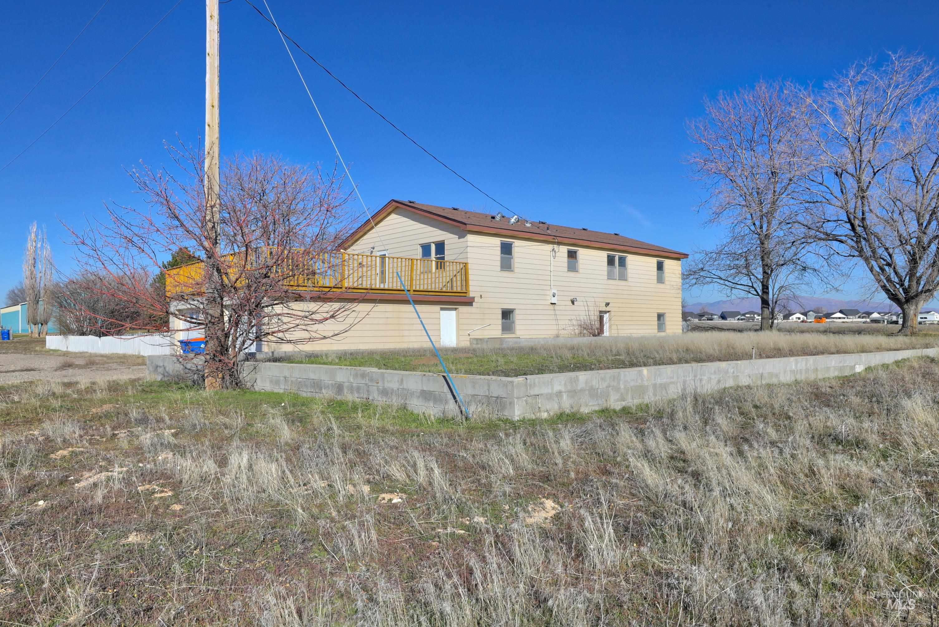 8027 Chuckar Lane Boise, ID 83709 - Photo 4 of 19 View of side of property featuring a deck