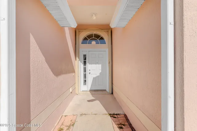a view of a hallway with front door